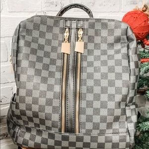 LIKE NEW: Black checkered backpack